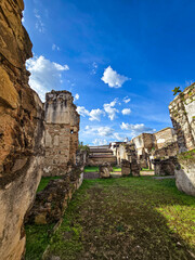 Ancient Ruins Under a Vibrant Sky: An eye-level perspective captures the weathered majesty of ancient ruins bathed in the warm embrace of sunlight.