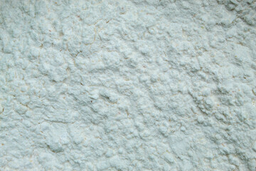 uneven texture of coarse and fine white powder