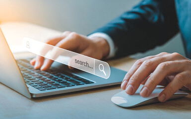 Fototapeta premium A person in a suit types on a laptop, with a search bar overlayed, indicating online research, digital marketing, and information gathering