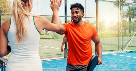 Sport, padel and team with high five on court for competition match, game winner and sportsmanship. Tennis players, happy people and celebration at fitness club for friendly tournament and practice