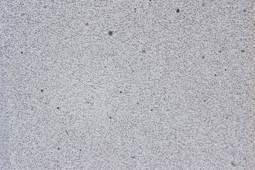 Large air voids in aerated concrete indicate poor mixing or curing, reducing structural integrity