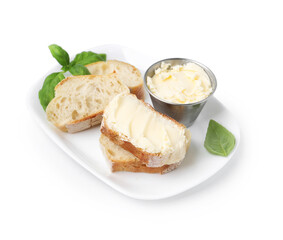 Slices of baguette with butter and basil isolated on white