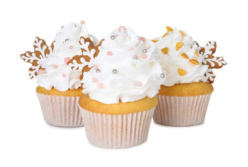 Tasty cupcakes with Christmas decor isolated on white
