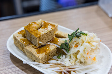 Fried stinky tofu served with pickled cabbage