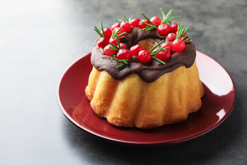 Tasty Christmas cake with cranberries on grey table, closeup. Space for text