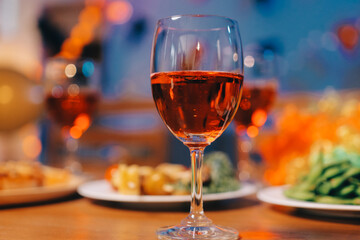 Joyful office Halloween party with coworkers in costumes, celebrating with drinks and laughter, fostering teamwork and festive spirit