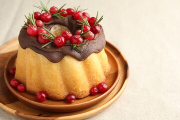 Tasty Christmas cake with cranberries on light table, closeup