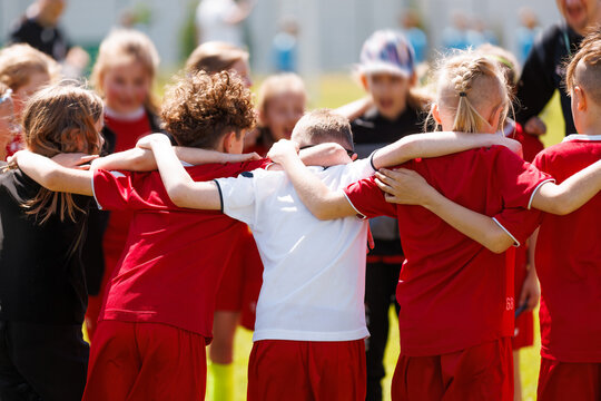 Kids Football Huddle – Youth Soccer Team Building Before Game. Teamwork, Motivation, and Sports Education for Children