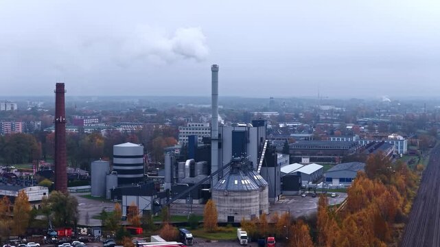Fossil fuel burning power station in cloudy day. Aerial view