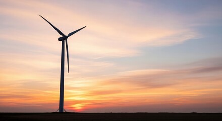 Obraz premium Wind Turbine at Sunset in a Scenic Landscape for Renewable Energy Projects and Sustainable Development