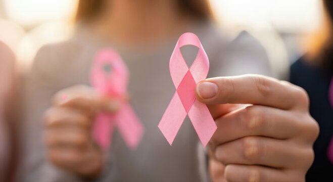 Awareness Campaign for Breast Cancer: Women Holding Pink Ribbons for Support and Education