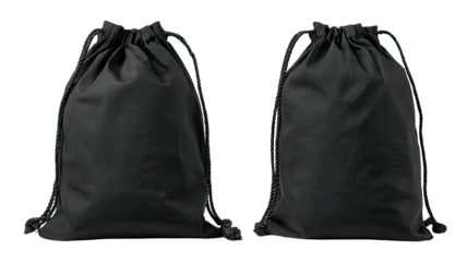Two black drawstring sacks, close up, on a black background