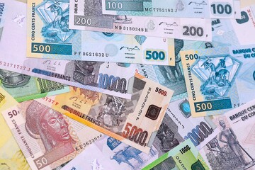 Congolese franc money bills in big amount on table close up. Rich life concept in Democratic Republic of Congo. Business and economy