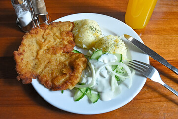 Pork chop with potatoes and cucumber salad