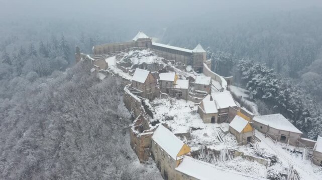 Winter view of Rasnov Fortress ruins, aerial view. Brasov, Romania
