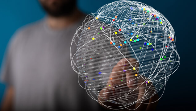 Abstract image of a person holding a globe of interconnected lines and dots. Representing the concept of global network, communication and conne