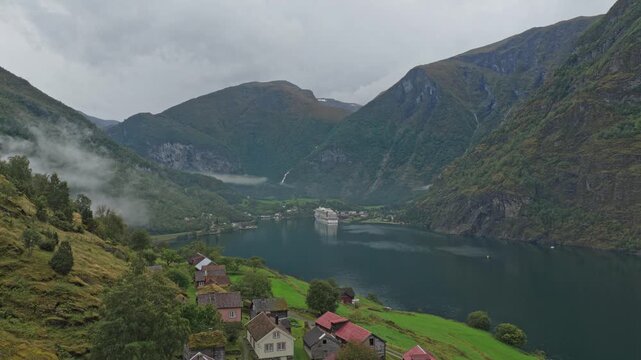 Historic Otternes village captured during overcast day along Norwegian fjord