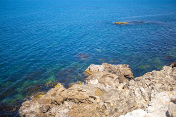 View of the rocky coast on the seashore, View from above of the stone beach