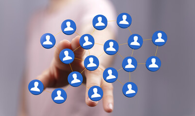 Hand touching network of people icons. Concept of social connection, community, and future communication techno