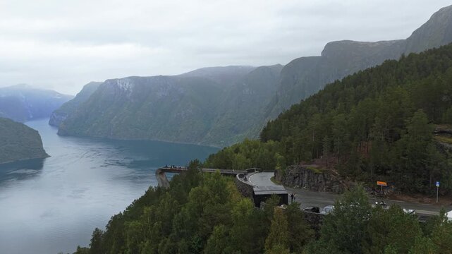 Stegastein platform overlooks Aurlandsfjord in Norway, scenic view from above, drone footage