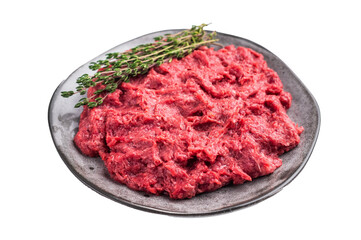 Uncooked venison mince with fresh herbs on a textured grey plate. Clean and simple composition for a healthy food concept.