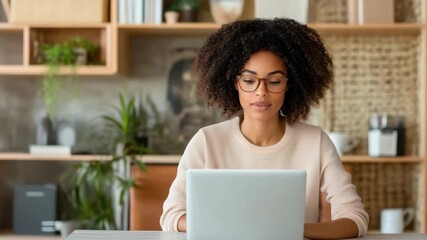 Young woman laptop home office workspace remote work desk with cozy modern decor and plants - Powered by Adobe