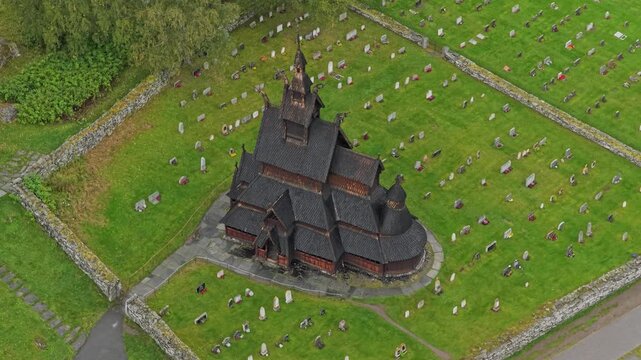 Top-down view of the iconic Borgund Stave Church nestled in lush Norway surroundings