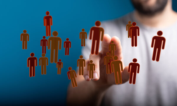 Concept of teamwork and communication in business. Hand touching digital figures representing connection and people network on a blue background