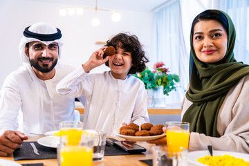 Middle eastern family enjoying meal together at home