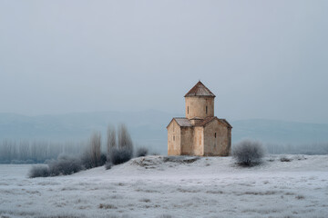 stone church stands majestically in snowcovered field under grey overcast sky