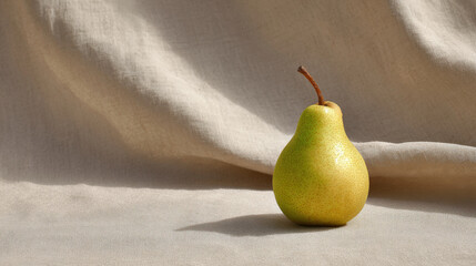 fresh ripe pear rests elegantly against backdrop of soft linen fabric illuminated by ultrabright sunlight