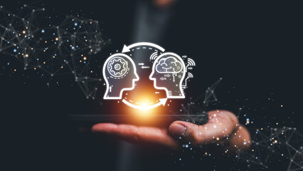 Futuristic of two human profiles exchanging data and ideas above a glowing device, symbolizing artificial intelligence, knowledge transfer, digital innovation, advanced technology communication.