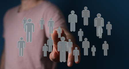 Close-up of a hand interacting with a network of digital human figures representing teamwork, connections, and