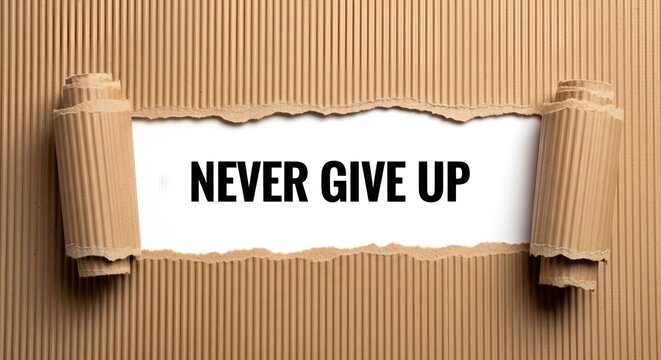 Torn cardboard paper revealing the motivational text never give up on a white background, symbolizing perseverance and determination