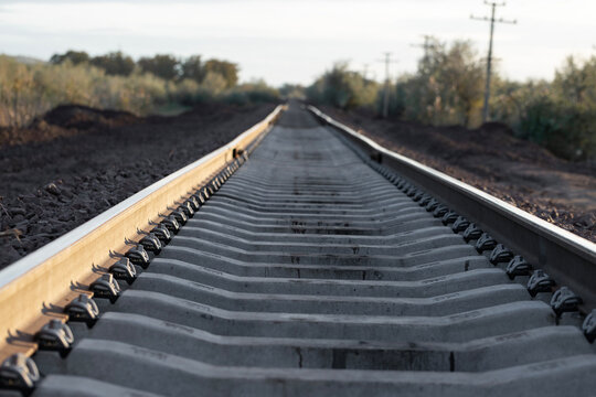 Railway tracks at sunset. New infrastructure for train traffic