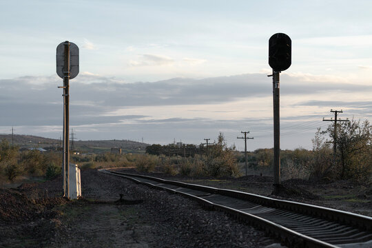 Railway tracks at sunset. New infrastructure for train traffic - Powered by Adobe