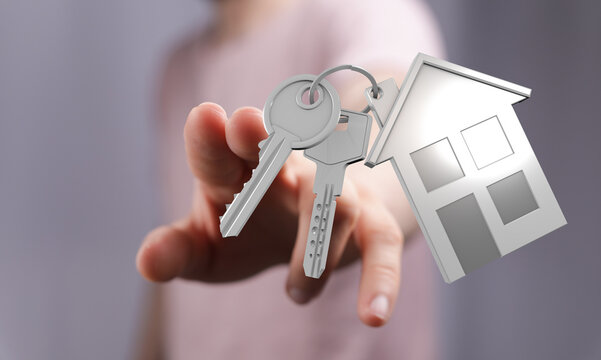 Close-up of a hand presenting house keys with a miniature house keychain. Concept of homeownership, buying a house, real estate, and new beginni - Powered by Adobe