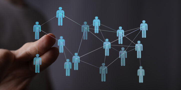 Hand touching network of human icons. Concept of social network, communication, business connection, community.