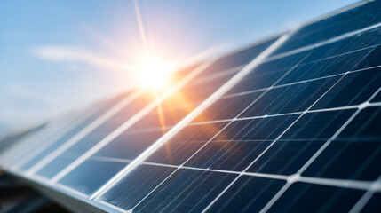 A close up of a solar panel with the sun shining through it and lens flare effects in background