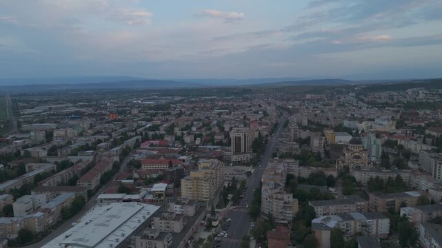 Aerial twilight view of Deva, capturing soft evening colors and the city&rsquo;s urban landscape.