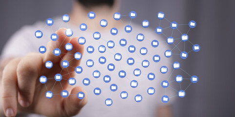 Close-up of a hand interacting with a digital network, representing data storage and file...