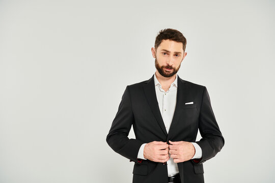 Bearded man showcases elegance in a suit for a Valentines Day moment