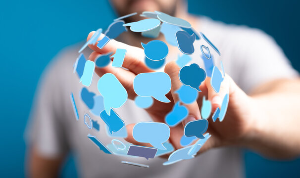 A man interacts with a sphere of speech bubbles, representing online connection and digital communication across networks.