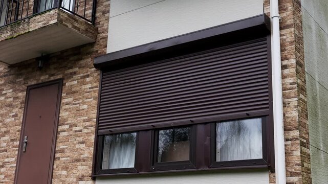 Rolling Shutter Window are Closed using smart home mobile app. High quality 4k footage