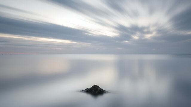 A peaceful misty sunrise over a calm lake with the reflection of a small boat, creating a tranquil and serene atmosphere perfect for nature, meditation, and peaceful journey visuals. - Powered by Adobe