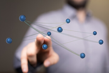 Person interacting with a digital network, representing technology, global connection, and data visualization.