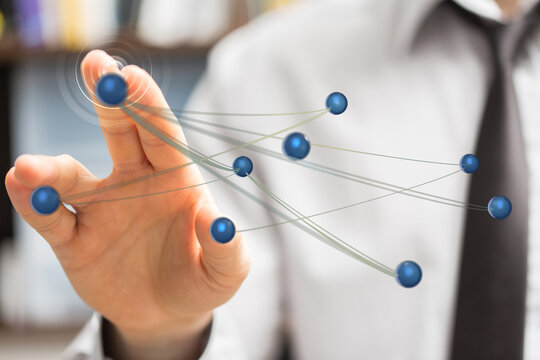 Close up of a businessman touching virtual connections, representing technology, communication, and innovation.