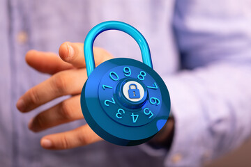 Image of a hand holding a blue combination lock, symbolizing protection, privacy, and data...