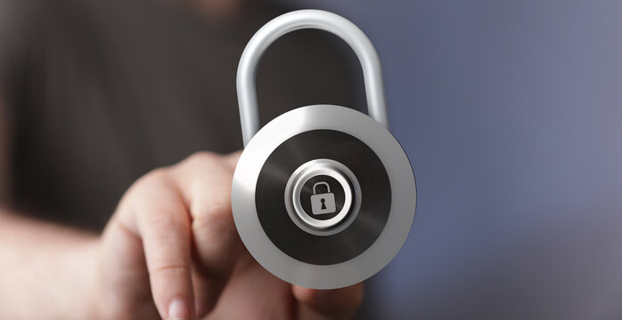 Close-up of a hand holding a metallic padlock representing concepts of protection, safety, and digital security