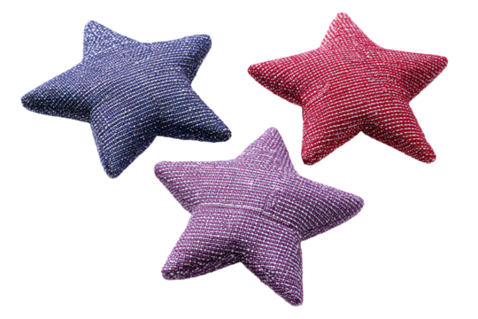 three star shaped cushions on a white surface